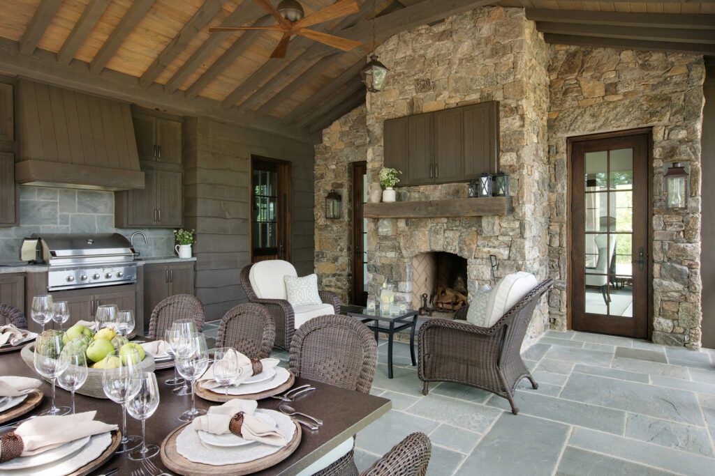 Cohesive back patio design with outdoor furnishings, kitchen and entertainment